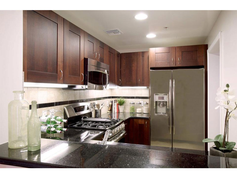 Custom kitchen with solid wood doors and marble top