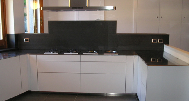 Kitchen cabinets in grey high-gloss lacquer